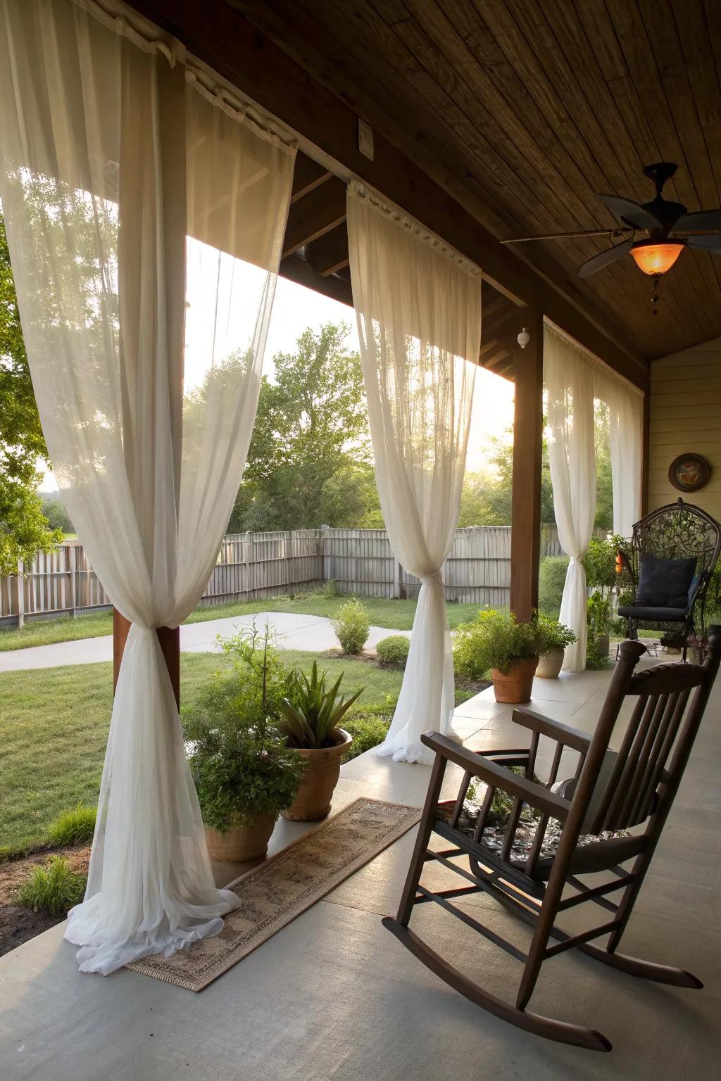 Curtains adding privacy and ambiance to a large front porch.