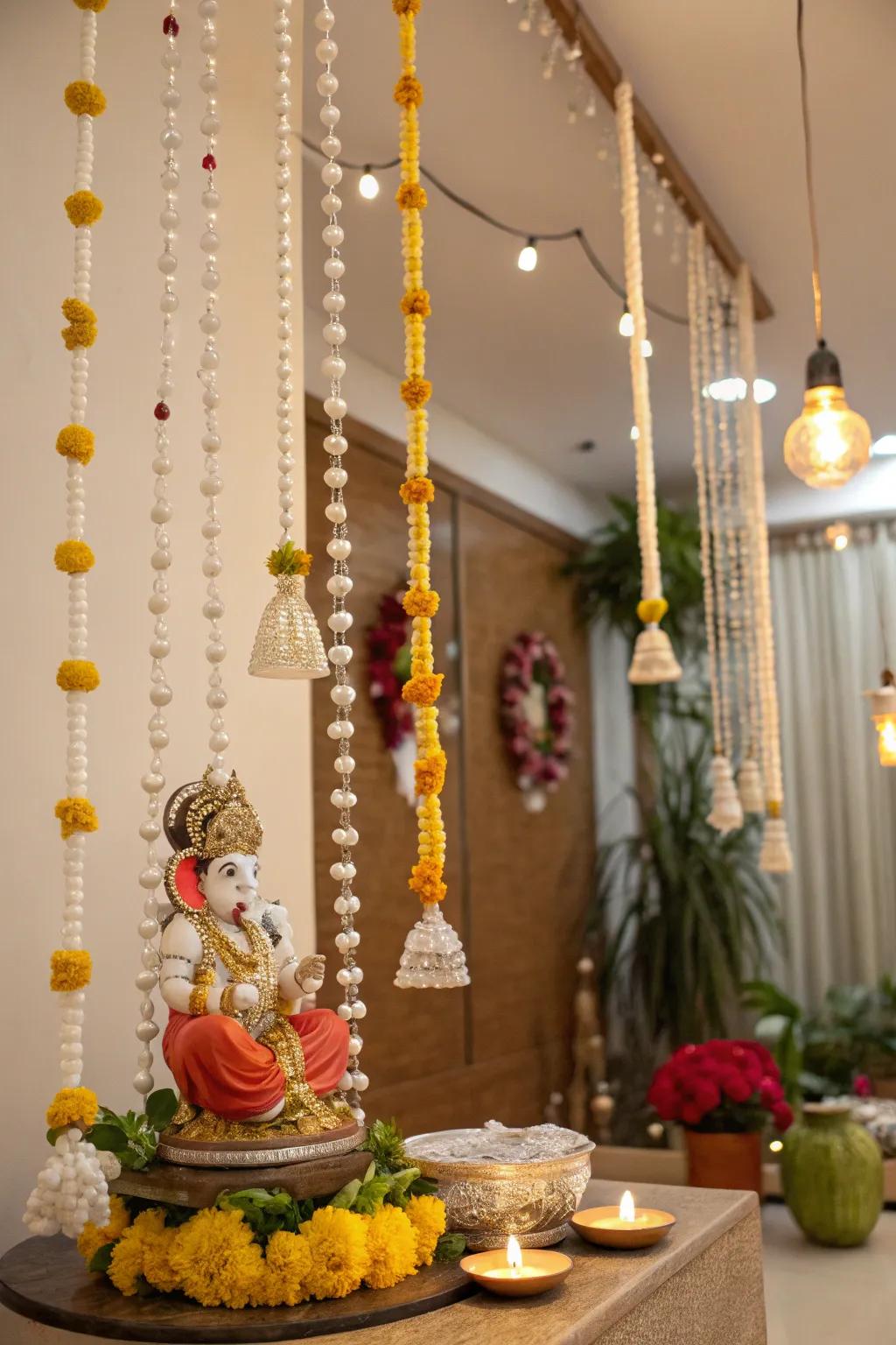Hanging beads and glass ornaments add sparkle and movement to this Ganpati setup.