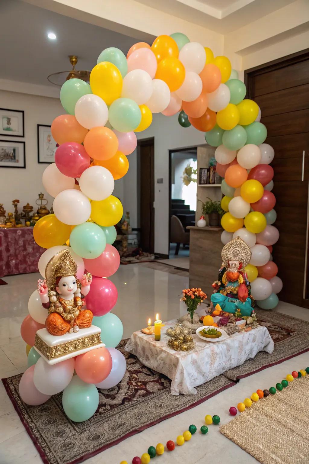 Festive balloons create a playful backdrop for this Ganpati setup.
