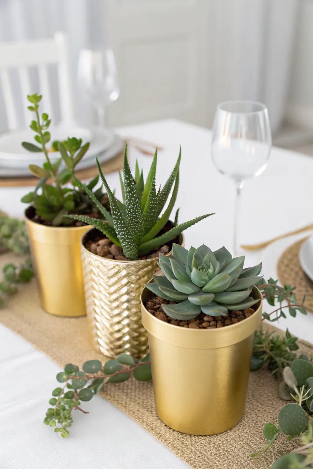 A chic centerpiece with succulents in gold pots.