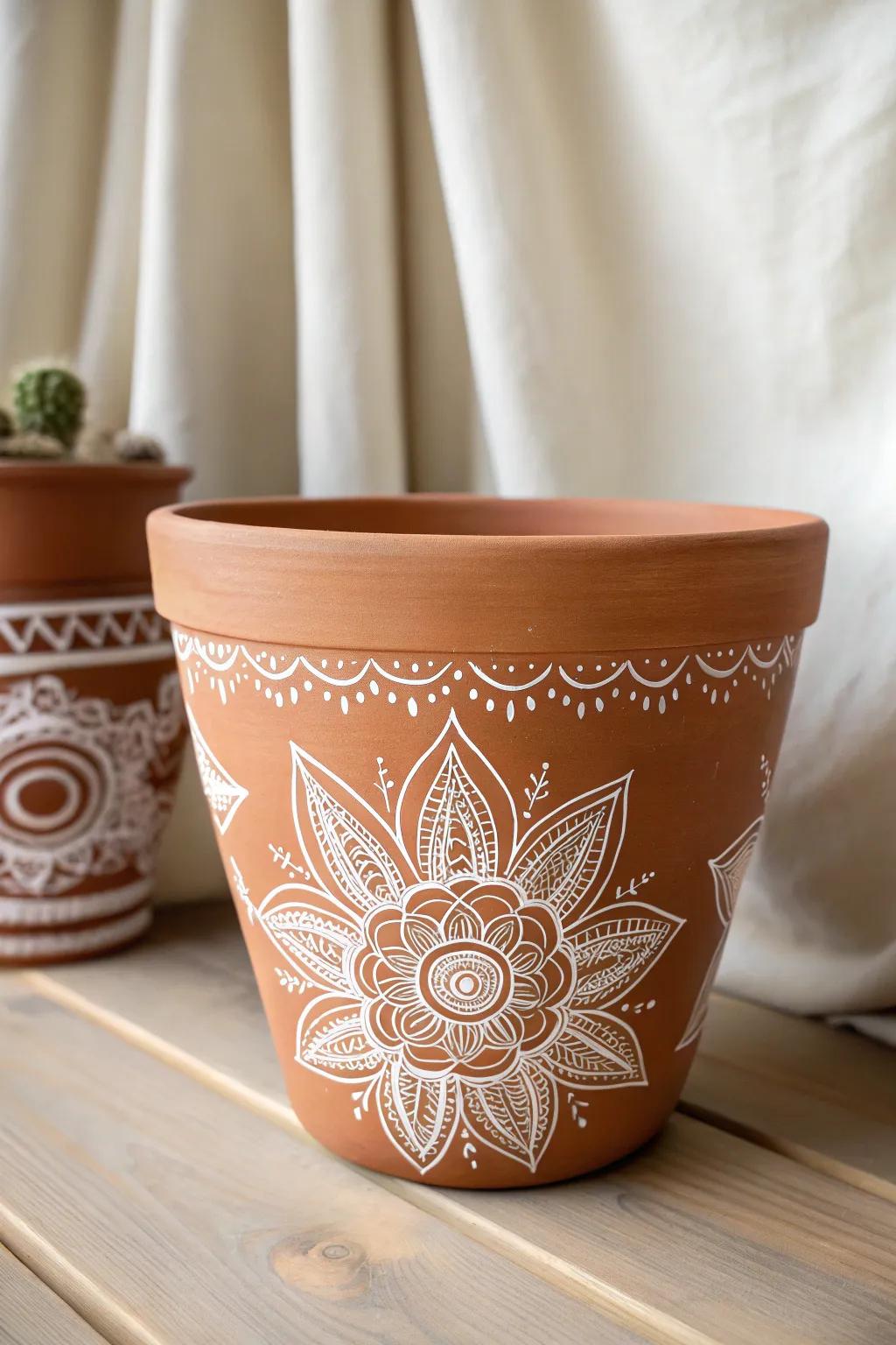 Elevate your space with the enchanting charm of hand-painted mandalas on a clay pot, where simplicity meets artistry.