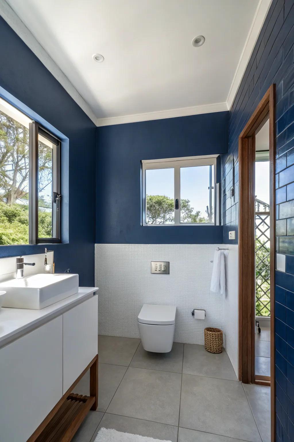 A blue accent wall adds drama and focus to the room.